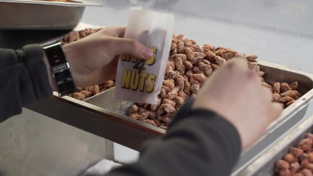 Roasted nuts being scooped up in New York City