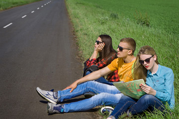 Young hipster friends travel on road