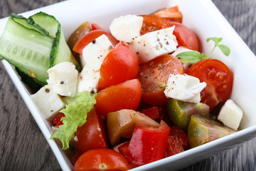 Salad with mozzarella, tomato and cucumber