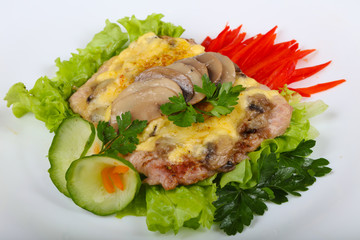 Pork steak with mushroom and cheese