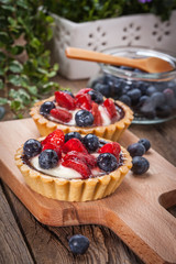 Fresh homemade fruit tart with strawberries and blueberries.