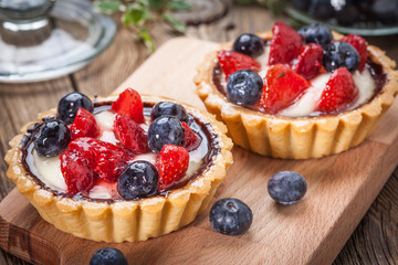 Fresh homemade fruit tart with strawberries and blueberries.