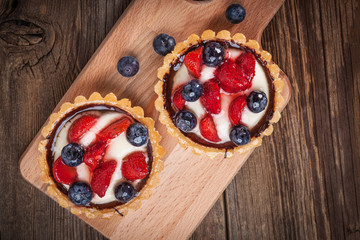 Fresh homemade fruit tart with strawberries and blueberries.