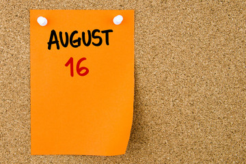 16 AUGUST written on orange paper note