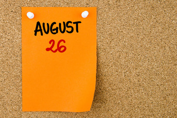 26 AUGUST written on orange paper note