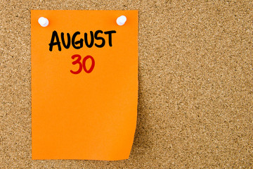 30 AUGUST written on orange paper note