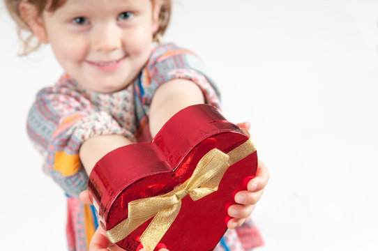 Child Giving A Present