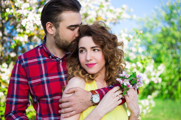 Fototapeta premium young beautiful couple in love embracing in park