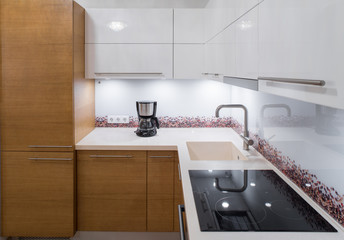 Modern kitchen unit with integrated appliances.