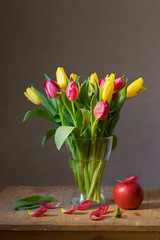 Still life with a bunch of yellow and red tulips