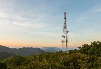 Peel and stick wallpaper City building Communication tower antenna on mountain at twilight