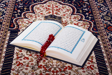 Holy Quraan on a prayer carpet