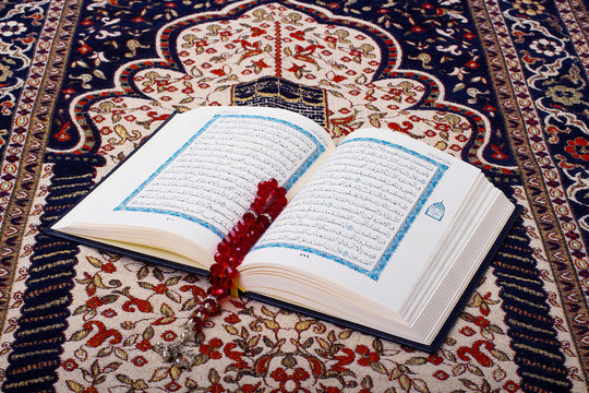 Holy Quraan on a prayer carpet