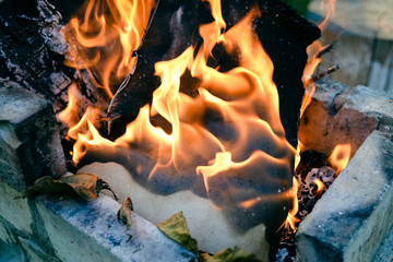 Closeup on golden flames of fire 