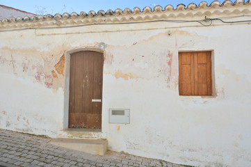 Background photo of old vintage wall with wooden window and door.