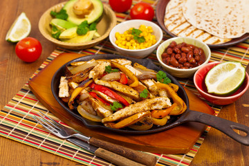 Chicken Fajitas with Grilled Onions and Bell Peppers. Selective focus.