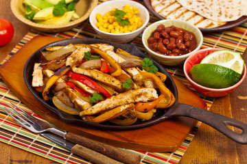 Chicken Fajitas with Grilled Onions and Bell Peppers. Selective focus.