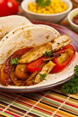 Fajita Chicken Tacos with Grilled Onions and Bell Peppers. Selective focus.