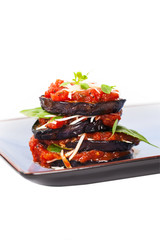 Layered Italian Eggplant Appetizer on White Background. Selective focus.