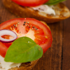 Bruschetta Sandwich with Tomato, Cream Cheese and Basil. Selective focus.