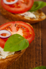 Bruschetta Sandwich with Tomato, Cream Cheese and Basil. Selective focus.