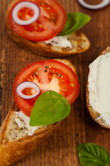 Bruschetta Sandwich with Tomato, Cream Cheese and Basil. Selective focus.