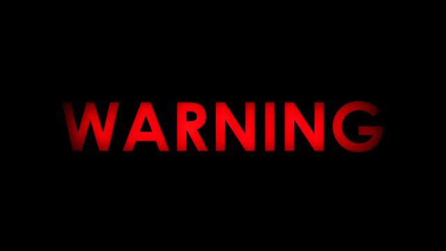 Warning! Red flashing warning message text on black background. Two speeds. Seamlessly loopable. 4K.