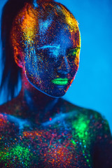 Girl colored fluorescent powder.