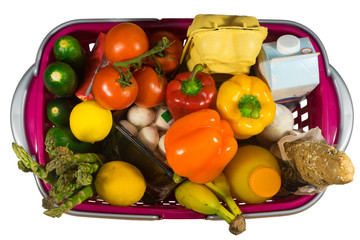 Shopping basket full with food products isolated