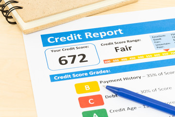 Fair credit score report with pen