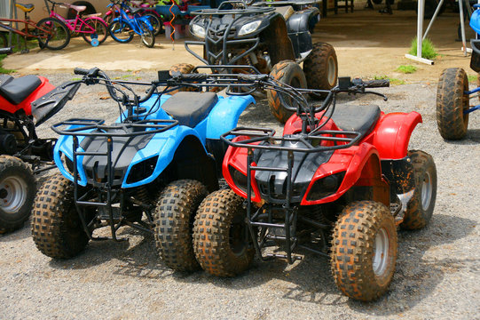 Red and blue ATV quad bike in Thailand
