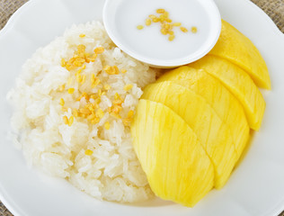 Sweet mango with sticky rice mix with coconut milk