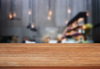 Top wooden table with blurred cafe background