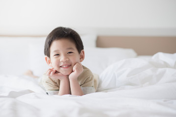 Cute asian child lying