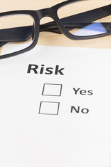 Risk assessment check box and glasses