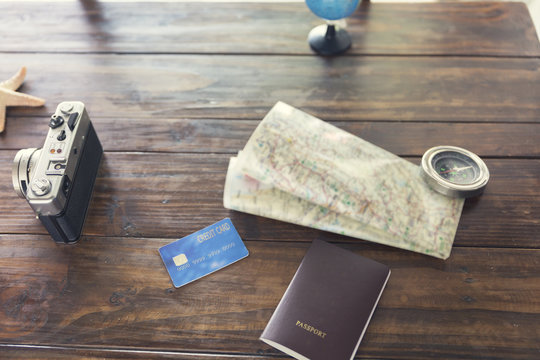 compass, passport, credit card, camera, map, starfish for use as