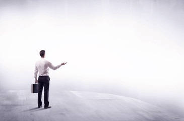 Business person standing from rear view