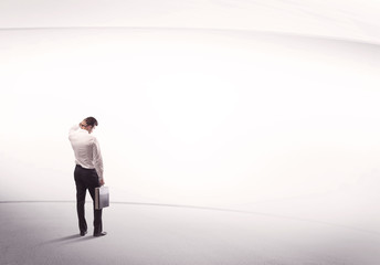 Fototapeta premium Businessman with briefcase standing still
