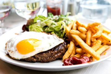 Egg and fries - classical english breakfast with egg and fries