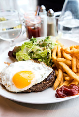 Egg and fries - classical english breakfast with egg and fries