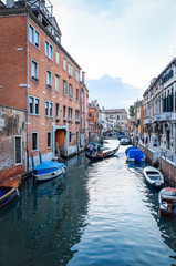 Fototapeta na wymiar Beautiful view of water street and old buildings in Venice on Ma