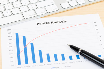 Pareto principle business analysis planning with pen, and keyboa