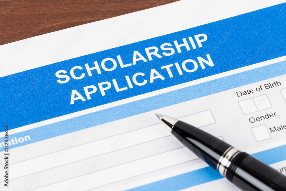 Wall mural Scholarship application form with pen