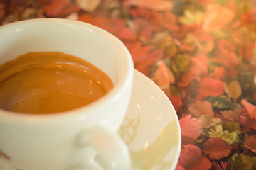 Coffee on table with flower