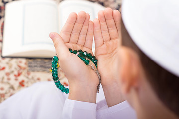 Little Muslim kid making duaa in Ramadan