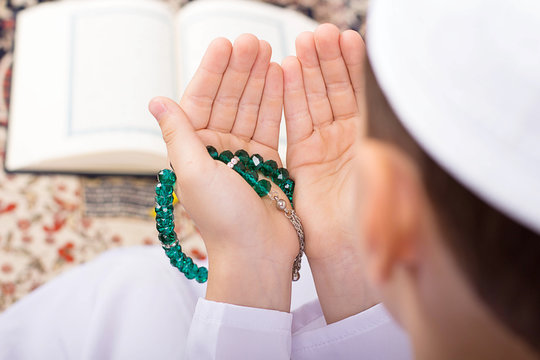 Little Muslim kid making duaa in Ramadan