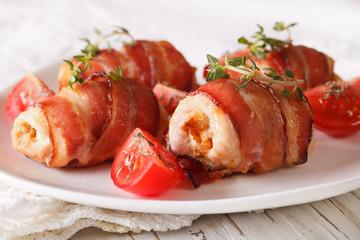 Chicken breast wrapped in bacon close-up. horizontal
