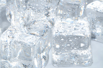Macro detail of ice cubes with water droplet