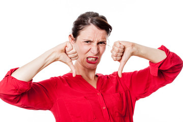 Naklejka premium furious young woman with disappointed thumbs down grinding teeth