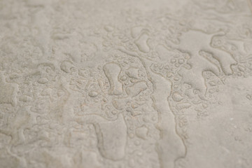 Fototapeta na wymiar Water drops over stone texture background